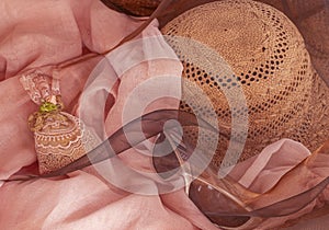 Closeup with pink organdy, straw sun hat and sunglasses shows getting ready to go on a trip, weekend away, or travel cruise4 .