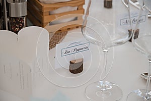Closeup of a place setting with name tag on table at wedding banquet.