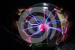 Closeup of a plasma globe in the darkness
