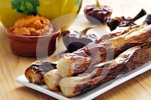 Barbecued calcots, catalan sweet onions, and romesco sauce photo