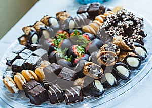 Closeup of a plate of chocolate-covered candies for a banquet