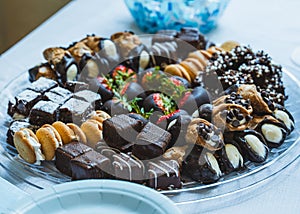 Closeup of a plate of chocolate-covered candies for a banquet