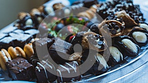 Closeup of a plate of chocolate-covered candies for a banquet