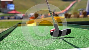 Closeup of player play mini golf