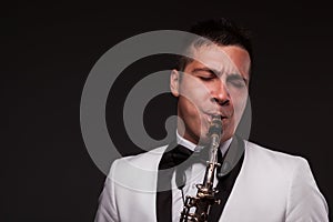 Closeup of playing saxophonist