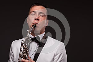 Closeup of playing saxophonist