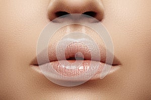 Closeup plump Lips. Lip Care, Augmentation, Fillers. Macro photo with Face detail. Natural shape with perfect contour