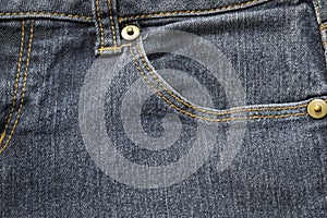 Closeup pocket on blue denim jean and button