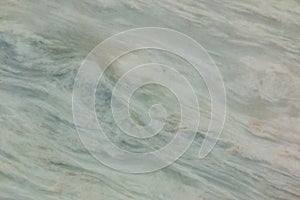 Closeup of polished marble, cream, white and green