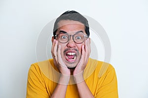 Closeup portrait of Adult Asian man screaming scared