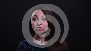 Closeup portrait of adult beautiful caucasian brunette female being sad and disappointed looking at camera with