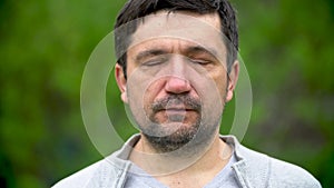 Closeup portrait of an adult man with a beard