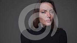 Closeup portrait of adult sad caucasian female being depressed and upset looking at camera with background isolated on