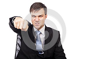 Closeup portrait of an angry businessman threatening with his fist