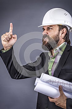 Closeup portrait of an angry engineer threatening