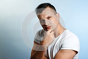 Closeup portrait of arrogant young man in brown shirt who thinks highly of himself, isolated on white background. Negative human