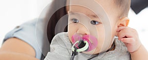 Closeup portrait of asian newborn, happiness face little baby girl with innocent.