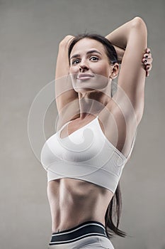 Closeup portrait of athletic fitness woman in gym