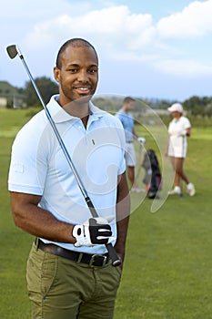 Closeup portrait of athletic male golfer