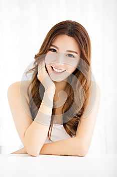 Closeup portrait of attractive young woman smiling