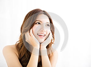 Closeup portrait of attractive young woman smiling and looking