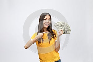 Closeup portrait of beautiful asian woman holding money isolated on white background. Asian girl counting her salary