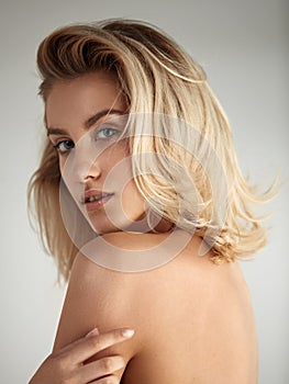 Closeup portrait of a beautiful blond young woman