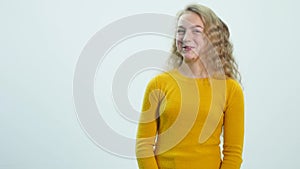 Closeup portrait of beautiful girl laughing and looking into camera. Teenager show emotions