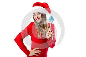 Closeup portrait of beautiful girl in red with santa hat holding