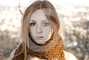 Closeup portrait of beautiful pure girl in scarf winter