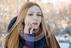 Closeup portrait of beautiful sensual girl in winter