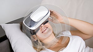 Closeup portrait of beautiful smiling woman wearing virtual reality headset