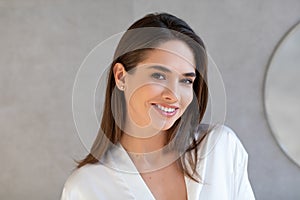 Closeup Portrait Of Beautiful Young Woman With Perfect Skin Looking At Camera