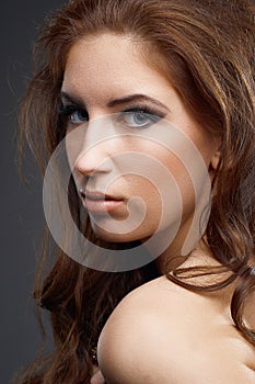 Closeup Portrait of beauty woman with Long Curly Hair.