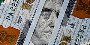 Closeup portrait Benjamin Franklin on 100 us dollar bill.