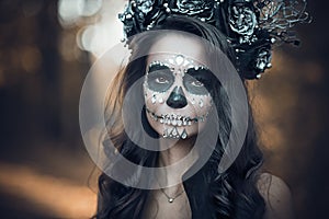 Closeup portrait of Calavera Catrina in black dress. Sugar skull makeup. Dia de los muertos. Day of The Dead. Halloween photo