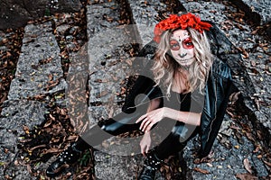 Closeup portrait of Calavera Catrina. Young woman with sugar skull makeup. Dia de los muertos. Day of The Dead