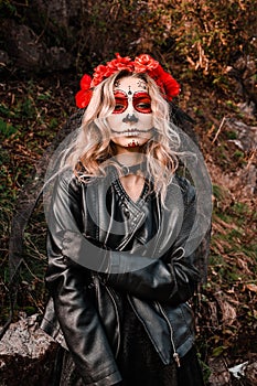 Closeup portrait of Calavera Catrina. Young woman with sugar skull makeup. Dia de los muertos. Day of The Dead