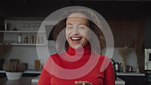 Closeup portrait of carefree excited pretty woman laughing with infectious laughter indoors