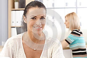 Closeup portrait of casual happy office secretary