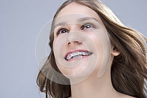 Closeup Portrait of Caucasian Female Teenage Girl With Teeth Bra