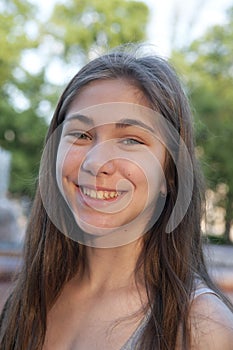 Closeup portrait of charming young female smiling