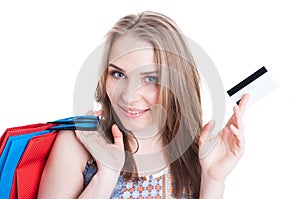 Closeup portrait of cheerful smiling shopper showing credit card