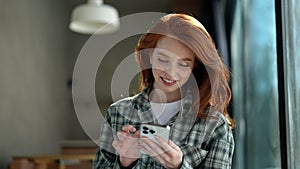 Closeup portrait of cheerful young woman feeling happy using mobile cell phone communicate with family enjoy life in