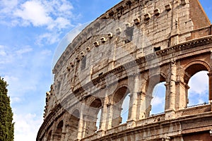 Closeup portrait of Coliseum building old wall with arch in Rome