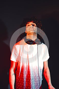 Closeup portrait of confident DJ with headphones