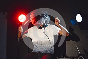 Closeup portrait of confident DJ with headphones