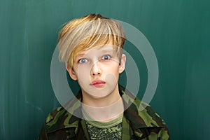 Closeup portrait of confident teenage boy. Studio portrait.