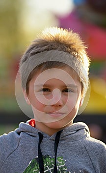 Closeup portrait of cute boy in park