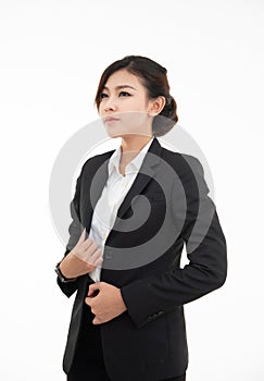 Closeup portrait of cute happy asian woman in black suit looking up isolated on white studio wall background with copy space above